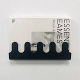 Wall-mounted metal hanger and shelf in matte black finish