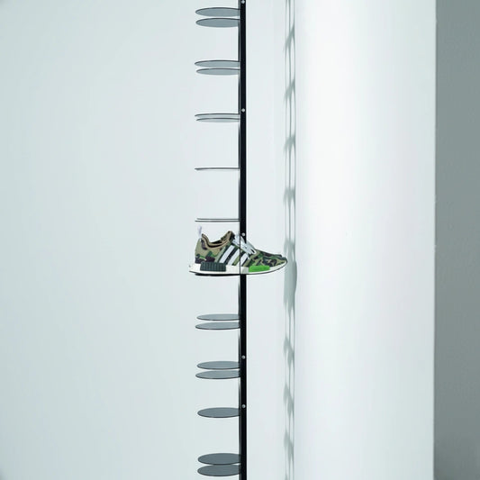 Wall-mounted metal shoe rack in matte black finish by MettiQ