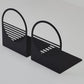 Matte black metal bookends by MettiQ